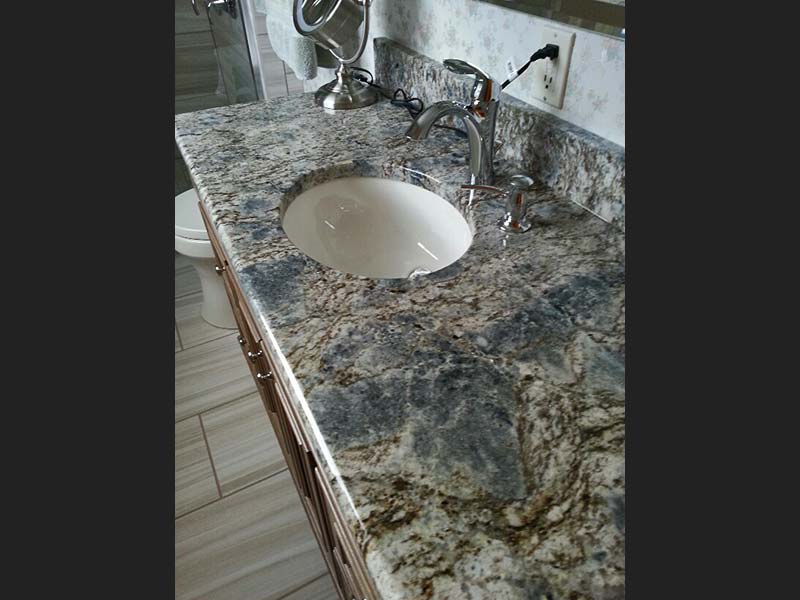 The length of this bathroom counter shows off Diamond Wave Granite's spectacular colors.